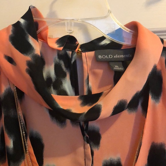 Bold elements black and orange-pinkish top. - Picture 2 of 4